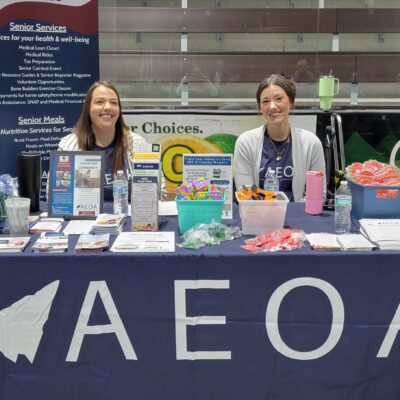 Nicole Mellesmoen and Lindsay Thompson await guests at the Senior Services table during AEOA's Senior Expo on Wednesday, May 6, 2026 at Iron Trail Motors Event Center.