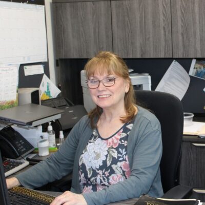 Director of Senior and Nutrition Services Marily Ocepek going over financials in her corner office at AEOA offices in Virginia on July 10, 2026. Ocepek will retire after 55 years with the agency on July 31, 2026.
