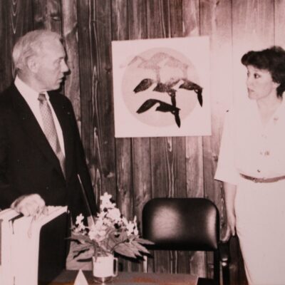 U.S. Rep. Jim Oberstar chats with Marilyn at AEOA offices in Virginia during a 1980s era visit to the agency.