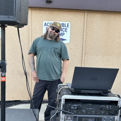 AEOA IT Systems Engineer Jeremy Emery moonlights during the agency’s 4th Annual Block Party as emcee with D&J Sound.
